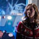 Judy Greer as Karen in Halloween Kills, looking worried and wearing a red-and-green Christmas sweater.